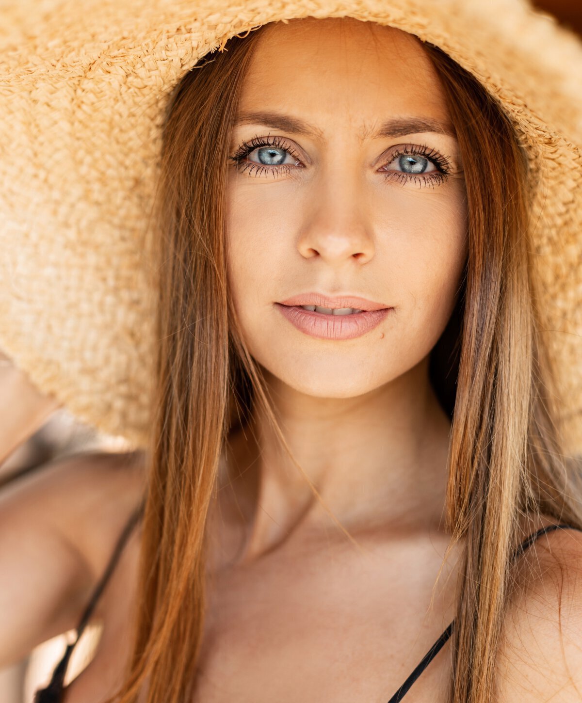 Irvine Medspa model with tan hat